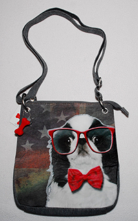 Japanese Chin Purse 2 has a boy Japanese Chin image on multi-colored hoodie material with adjustable shoulder straps and red dog bone accent. Measures 11.00" X 10.00" (27.94 X 25.40 cm).