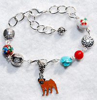 Frida E Pug Bracelet - Silver plated chain with foil-lined Lampwork heart, red, pink, and purple beads, and enamel Pug Charm. Adjusts from 6.75" to 8.00" (17.145-20.32 cm).