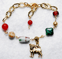 Pug Bracelet 7 - This gold plated chain features genuine Carnelian, Jasper, antique African wood, Czech glass, and a gold pewter pug charm. Adjusts from 6.75" to 8.25" (17.14-20.95 cm)