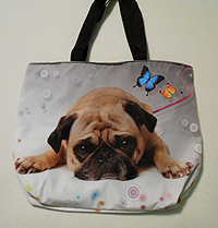 Pug Purse 29 can be used as a purse or tote and measures 17.00" X 14.50" (43.18 X 36.83 cm) and is large enough to carry books and/or tablet! A cute pug sits on the foreground with a gray and white background of retro circles and colorful butterflies. There is also a zippered inner compartment and black shoulder straps.