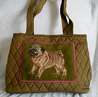 PugSpeak Pug Purse 31 is a olive green quilted pug handbag with needlepoint pug framed in pink and features shoulder straps. Divided compartments keep your contents neat and easy to find! Measures 14.00" X 9.00" X 6.00" (35.56X22.86 X15.24 cm). 