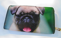 Pug Wallet 6.Happy Pug on green background with faux leather zip-around with zippered coin as a divider and five card slots. Wallet Measures 7.50" X 4.50" 