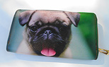 Pug Wallet 6. Happy Pug on green background with faux leather zip-around with zippered coin as a divider and five card slots. Wallet Measures 7.50" X 4.50".
